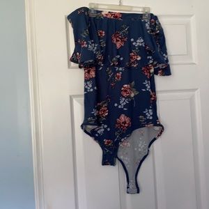 Rue 21  patterned body suit. Size large.